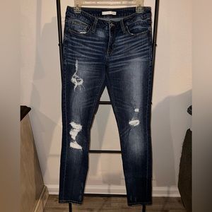 Buckle dark wash distressed skinny jeans